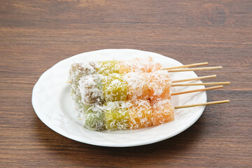 Sentiling or ongol-ongol, Indonesian traditional snack, made from cassava sprinkled with grated coconut

