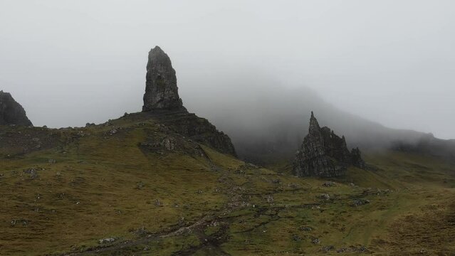 Aerial aproximation to the Old Man Storr in the island of Skye.  Landscape characterized by dramatic cliffs, rolling hills, and stunning views of the surrounding landscapes