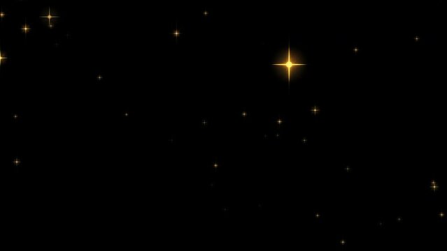 Beautiful gold sparkles, Christmas stars burst, light particles exploding transition on black background.