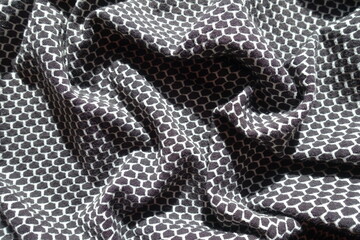 black and white jersey fabric with honeycomb pattern in soft folds