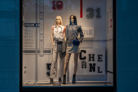 Chanel boutique display window with mannequin in haute couture clothes and luxury accessories for exclusive shopping and in most attractive tourists city in Singapore