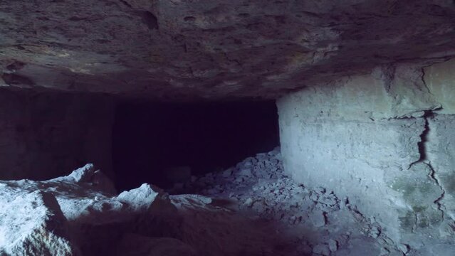 The entrance to the limestone quarry (stone sawing), which is 200 years old. The entrance is covered with centuries-old soil and is low. Object for spelunking