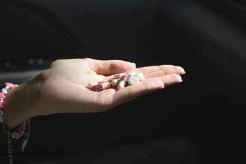 Caucasian female hand showing pill. Healthcare. Medical