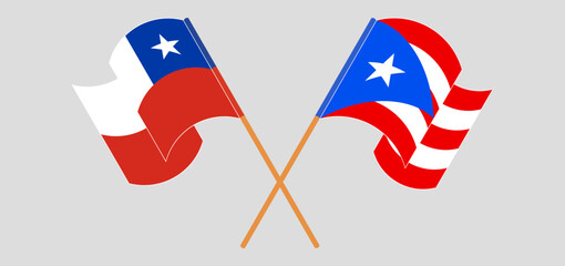 Crossed and waving flags of Chile and Puerto Rico