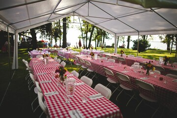 Outdoor restaurant with checkered tablecloths, and chairs in Ontario, Canada