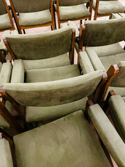 Fototapeta na wymiar Green velvet chairs next to each other
