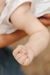 Close - up of small child 's hand with tiny fingers.Child protection. Baby care. Children's health. 