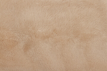 Background of artificial beige color close-up. Texture.