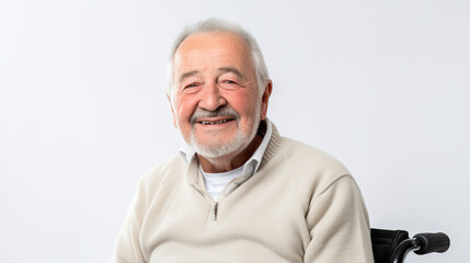 Obraz premium Portrait of a happy senior man sitting on wheelchair. Cheerful old man sitting on wheelchair. Disabled man in his wheelchair looking at camera.