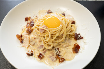Carbonara pasta, spaghetti with pancetta , bacon, egg, parmesan cheese and cream sauce. Traditional italian cuisine.