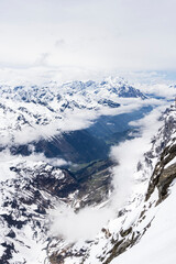 Snow landscape with valley view from Mount Titlis at 3020 meters altitude in Engelberg Switzerland