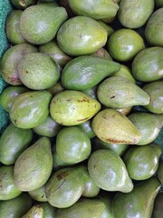 pile of avocados or scientifically known as Persea americana photographed at a high angle