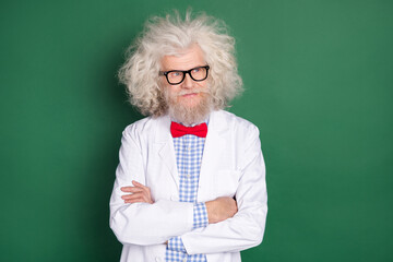 Photo of serious cool confident mad scientist look copyspace crossed arms crazy physician isolated...