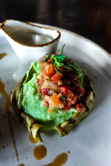 Dish Roll with zucchini and puree close-up with sauce
