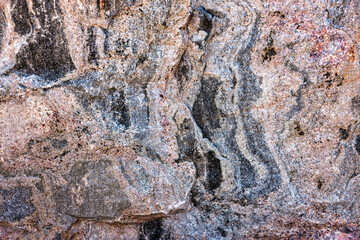 raw uncut red african granite texture, straight from the quarry