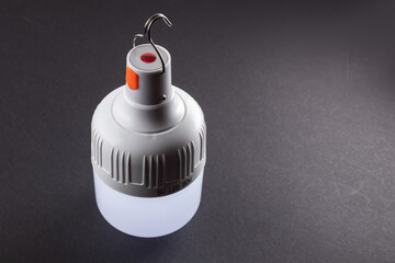 white emergency led bulbs with integrated battery on dark