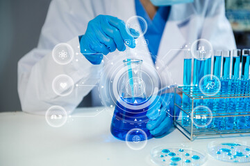 Fototapeta premium Scientist mixing chemical liquids in the chemistry lab. Researcher working in the chemical laboratory with virtual icon..