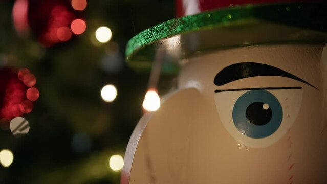 Nutcracker against the Christmas tree