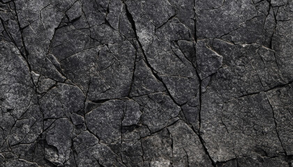 Black white rock texture. Dark gray stone granite background for design. Rough cracked mountain surface. Close-up