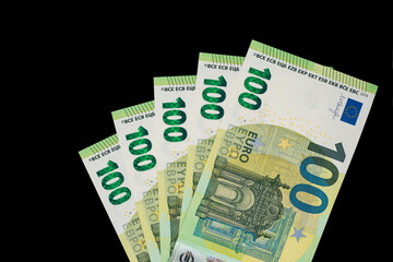 100 euro bills euro banknotes money on dark background. European Union Currency