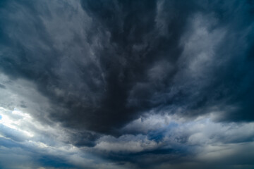 storm sky, dark dramatic clouds during thunderstorm, rain and wind, extreme weather, abstract background