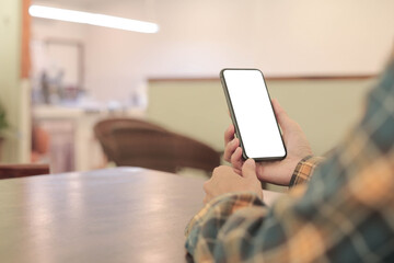 cell phone blank white screen mockup.hand holding texting using mobile on desk at office.background empty space for advertise.work people contact marketing business,technology