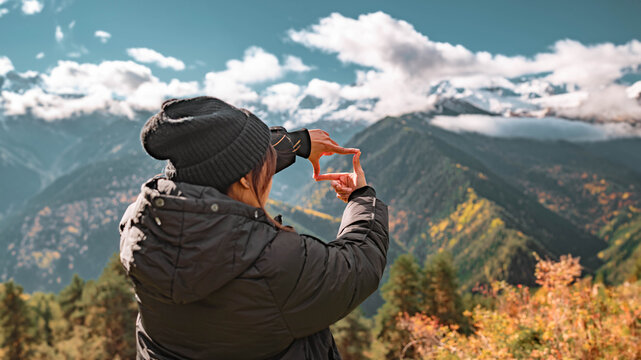 New year planning and vision concept, Close up of woman hands making frame gesture with beautiful mountain landscape autumn, Mestia - Georgia, Searching for best image composition as he hiking