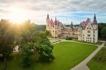 Moszna Castle from above: a fairytale castle with many towers, surrounded by a park, nicknamed the...