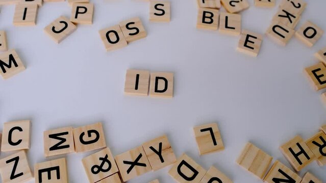 female hand collecting word idea on table made of wooden letters, concept creative process, education and innovation, innovative teamwork, showcasing collaborative effort, mosaic of thoughts