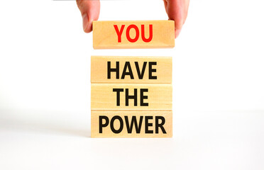 You have the power symbol. Concept word You have the power on beautiful wooden block. Beautiful white background. Businessman hand. Business motivational you have the power concept. Copy space.