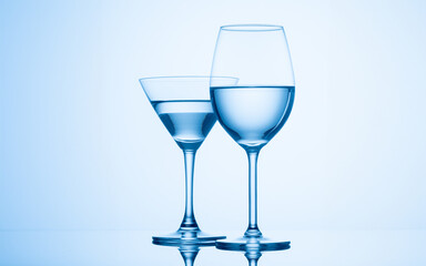 Refreshing drink in elegant stemware with reflective properties.