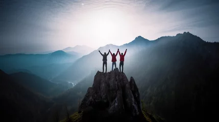 Fototapeten Together overcoming obstacles with three people holding hands up in the air on mountain top , celebrating success and achievements © IBEX.Media