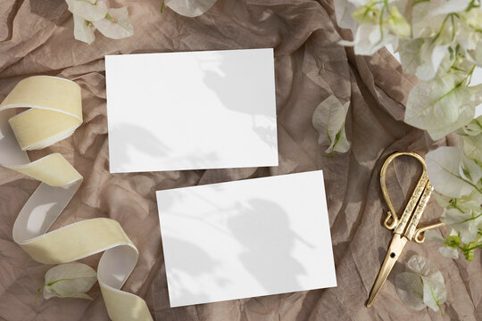 3,5x5 cards mockup with golden scissors on beige background 