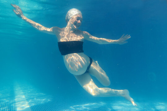 Pregnant woman in the pool.