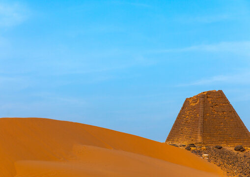 Tourist visiting the pyramids of the kushite rulers at Meroe, Northern State, Meroe, Sudan