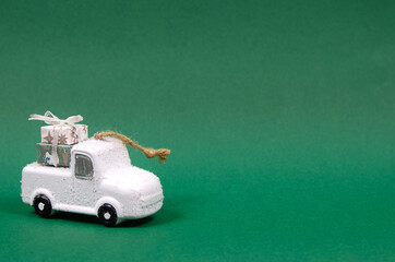 White christmas, new year car with gifts on green background
