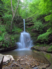 Mountain panorama nature. A beautiful watherfall in colorful forest. Scenery of nature.