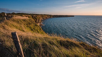 View of Pointe du Hoc in French Normandy at sunset.