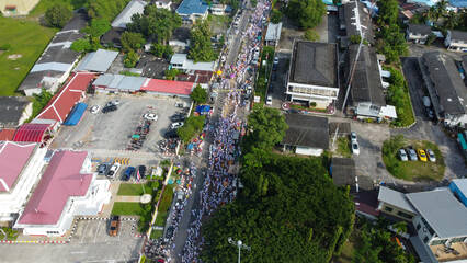 A bird's-eye view of people marching The tradition of eating precepts and eating vegetables in Phuket, Thailand.