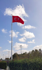 Turkish flag on cloudy blue sky  background, sunny day