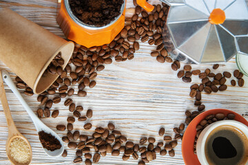 coffee beans, geyser coffee maker and a cup of aromatic espresso - coffee preparation background
