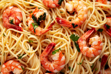 Homemade Cooked Garlic Shrimp Scampi on a Plate, top view. Flat lay, overhead, from above. Close-up.