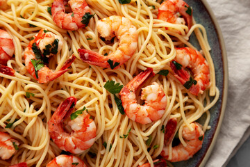 Homemade Cooked Garlic Shrimp Scampi on a Plate, top view. Flat lay, overhead, from above. Close-up.