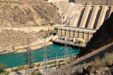Kurpsai Hydro station. Lower Naryn River Canyon near Toktogul in Kyrgyzstan. Hydroelectric dam in central asia - obrazy, fototapety, plakaty