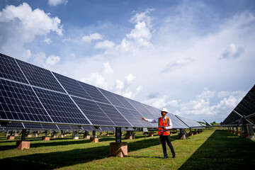 Businessman on a tour of solar power plants to check the operation of the power generation system. solar panels are an alternative electricity source to be sustainable resources in the future