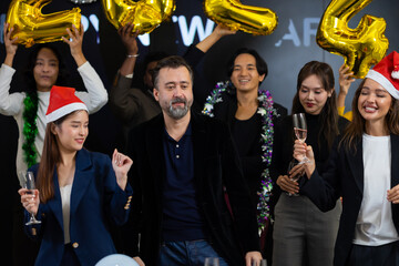 dance happy new year 2024 new year holidays. Business people celebrate and dancing on event happy new year party at office. Celebration Success Concept