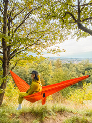 chilling woman laying down in hammock