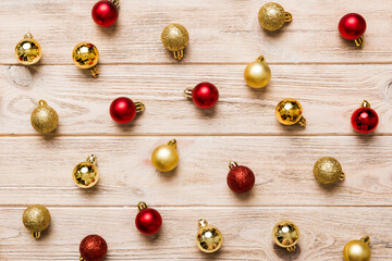 Christmas composition. a pattern of christmas balls on colored background. Flat lay, top view New year decor