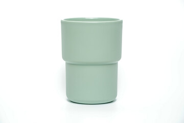 Plastic mug of different colors isolated on white, Clipping path included.