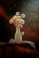 A bouquet of fluffy dandelions on a coffee table on a dark background